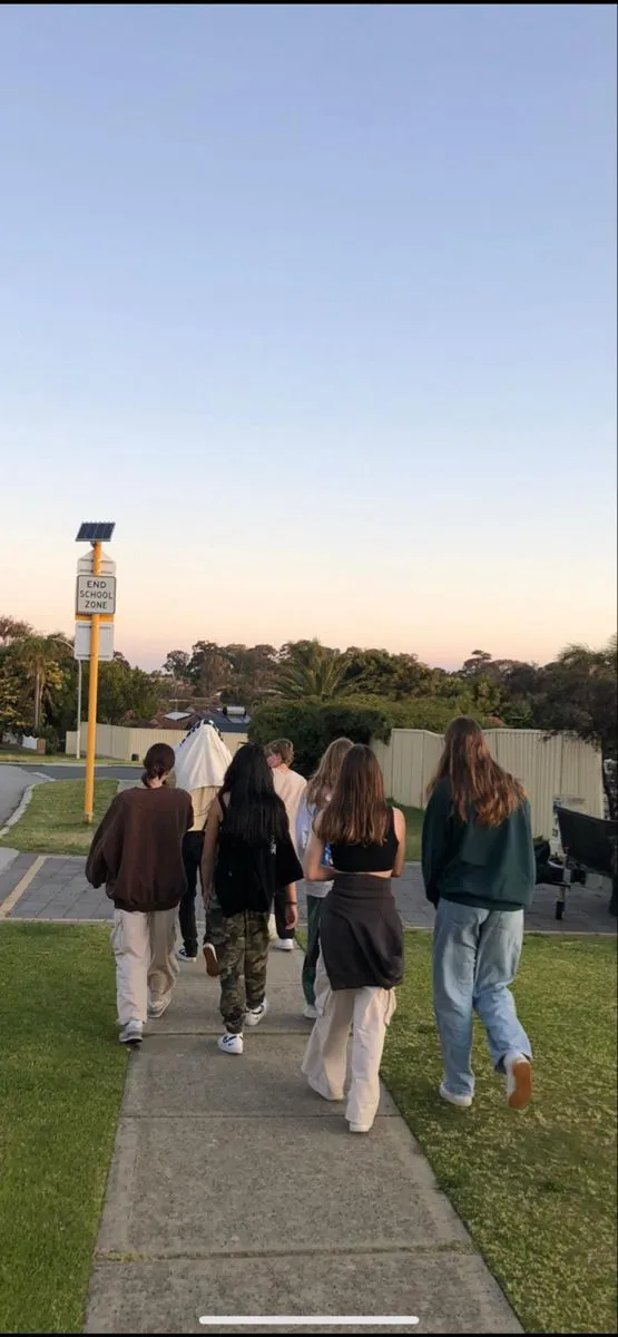 Friends walking together on a city street